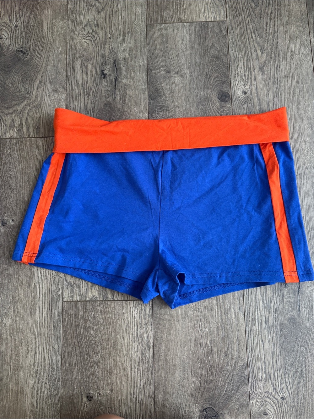 Women's Blue Athletic Shorts with Orange Waistband and Side Stripes